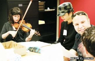 Violinist Flavie Halais (left) accompanies Charbel Nassif (Watson), Giovanni Bertole (Holmes) and Ceri Howells (Musgrave) at a readthrough of <em>The Musgrave Ritual</em>.